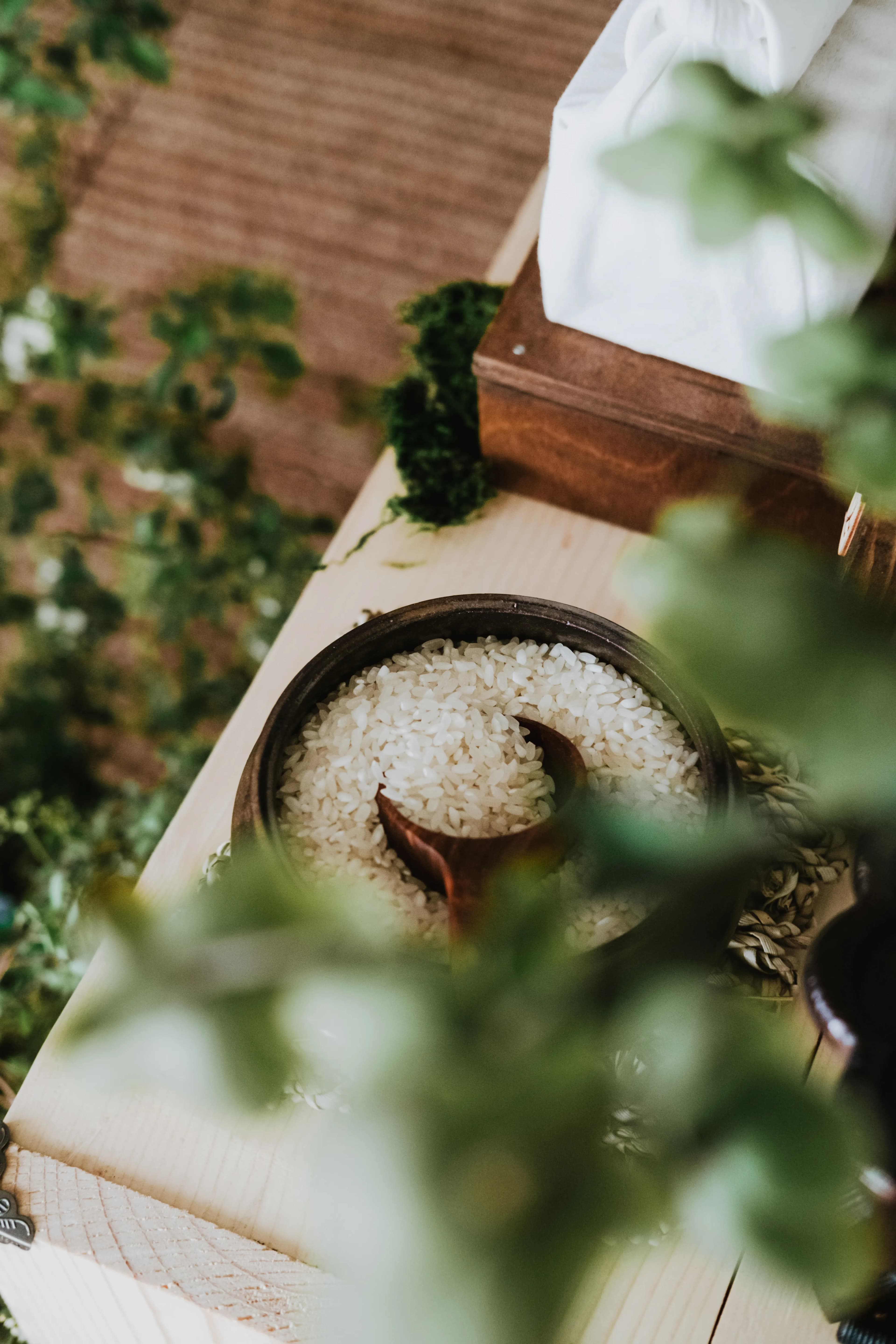 Overhead view of a ceramic bowl filled with cooked rice